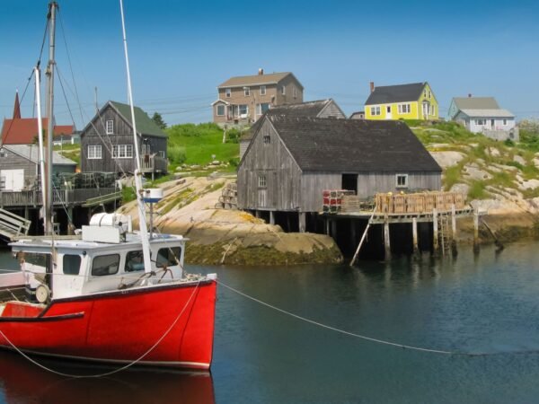 Red fishing boat by the docks, Peggy's Cove harbour scene, Nova Scotia